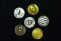 Close up of a collection of silver and gold crypto coins Royalty Free Stock Photo