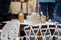 Close up of a collection of vintage ceramic and glass bottles on market stall at Frome Sunday Market, Somerset, UK