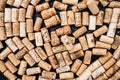 Close-up of collection of wine bottle corks with lettering.