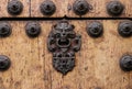 Close up of a colonial iron door handle with knocker Royalty Free Stock Photo