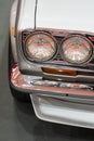 Close up Color detail on the headlight of a vintage car Royalty Free Stock Photo