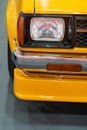 Close up Color detail on the headlight of a vintage car Royalty Free Stock Photo