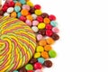 Close-up of colored lollipop and dessert colorful candy dragee on white background Royalty Free Stock Photo