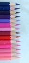 Close up Colored pencil from blue to pink white background Royalty Free Stock Photo