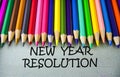 Close up colored pencil writing with NEW YEAR RESOLUTION.Education concept