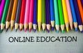 Close up colored pencil writing with ONLINE EDUCATION.Education concept