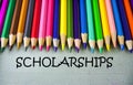 Close up colored pencil writing with SCHOLARSHIPS.Education concept