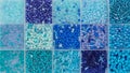 Close up of colorful blue seed beads in square sections flat lay, background Royalty Free Stock Photo