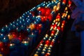 Close up of colorful candles in a dark spiritual scene. Commemoration, funeral, memorial. Religious symbolism