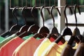 Close up colorful clothes hanging, Colorful t-shirt on hangers or fashion clothing on hangers