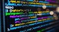 Close up of colorful computer code displayed on a dark screen with bokeh effects Royalty Free Stock Photo