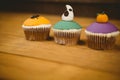 Colorful cup cakes on table during Halloween Royalty Free Stock Photo