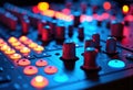 Close-up of a colorful DJ mixing console with illuminated controls and knobs Royalty Free Stock Photo
