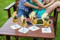 A close-up of colorful drinks tablet and smartphones on the table