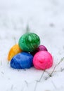 Close up of colorful easter eggs in snow, bury background Royalty Free Stock Photo