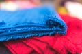 Blue and red textile fabrics on the table in a shop Royalty Free Stock Photo