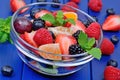 Colorful fruit salad in a transparent bowl Royalty Free Stock Photo