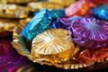 a close up of colorful hanukkah gelt in gold wrappers