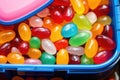 close-up of colorful jelly beans in a small lunchbox