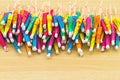 Close up colorful of many cocktail umbrellas on white wooden ba