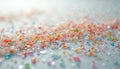 Close-up on colorful microplastics, speckled texture on blurred light background. Multi-colored plastic beads, granules scattered Royalty Free Stock Photo