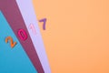 Close up of colorful number 2017 against wooden background. Selective focus.