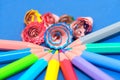 Close up of colorful pencil shavings together with pencils Royalty Free Stock Photo