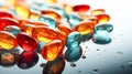 Close up of colorful pills on reflective surface. Focus on foreground. Royalty Free Stock Photo