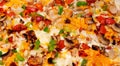 A closeup of a colorful pizza with lots of toppings.