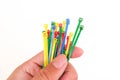 Colorful plastic cable ties in hand isolated Royalty Free Stock Photo