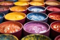 close-up of colorful pottery glazes on palette