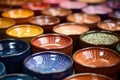 close-up of colorful pottery glazes on palette