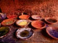 Close up of colorful, powdered dyes on plates in the souk of Marrakech. Dried colors in the Medina, Morocco.