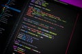 Close-up of colorful programming code on screen showing Vite, Vue 3, TypeScript, Tailwind, Pinia, and Axios configuration, Royalty Free Stock Photo