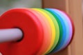 Close up of colorful rainbow wooden circles on the playground