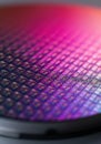 Close-up of a colorful semiconductor wafer showcasing intricate patterns
