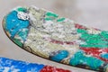 Close-up of a colorful ski and snowboards with snowflakes