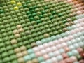 Close-up, colorful square diamond embroidery bright. Hobbies and entertainment