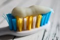 Close up of colorful toothbrush with toothpaste close up macro on wooden table Royalty Free Stock Photo