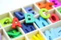 Close up Colorful wooden English alphabet on white background.