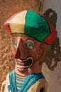 Close-up of colorful wooden puppet reminding a clown in Paraty.