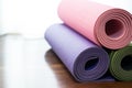 Colorful yoga mat on the floor, sport and healthy concept