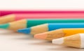 Close up of coloured pencils, lined in a row Royalty Free Stock Photo