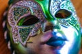 Close up of colourful blue and green glittery masquerade mask