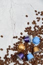 Close up colourful coffee capsules with roasted grains on gray concrete Royalty Free Stock Photo