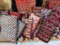 Close up colourful handmade Moroccan cushions in traditional patterns