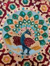 Close up of colourful peacock pattern on traditional Indian souvenir