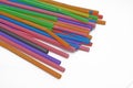 Close up colourful straws over the white background