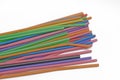 Close up colourful straws over the white background