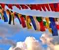 Close up of colourful Tibetan prayer flags in sky, Boudhanath, Nepal Royalty Free Stock Photo